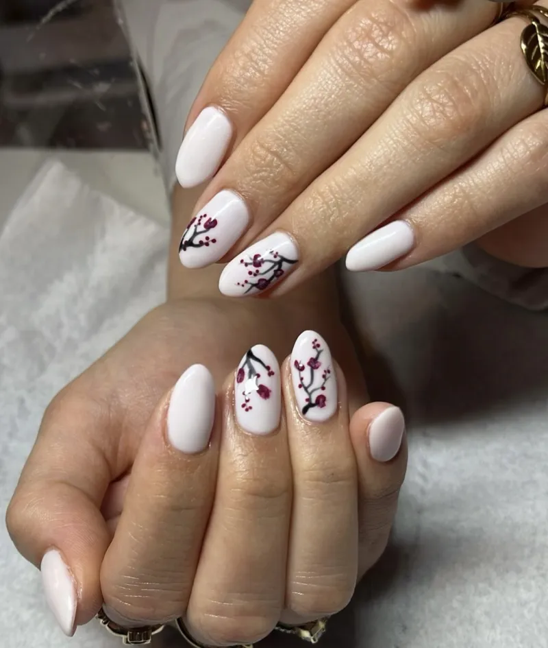 White nails with a Japanese floral design