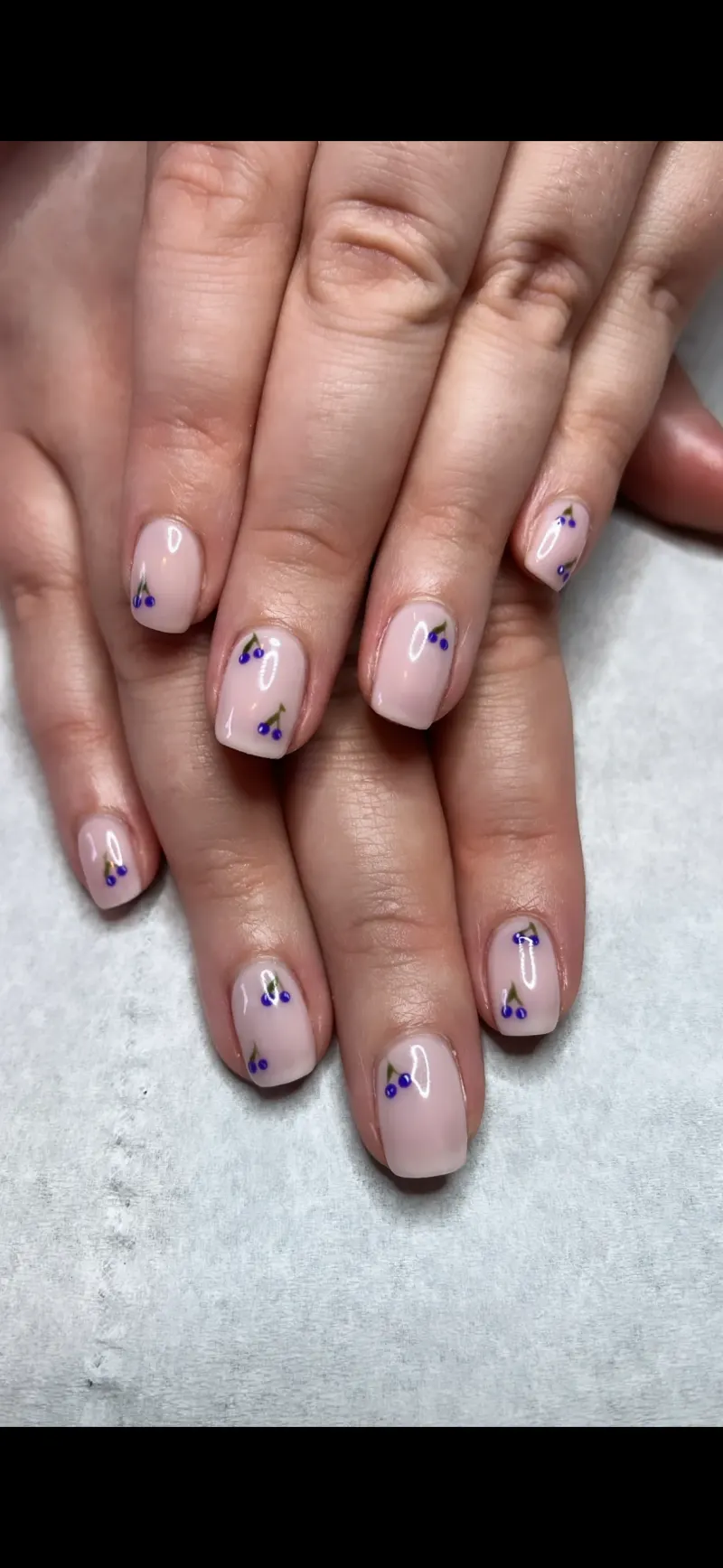 Light pink nails with fruit designs
